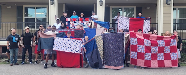 Veterans at Camp Hope receive quilts from LWML