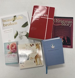 Christian devotionals, books, and Bibles are given to the women 