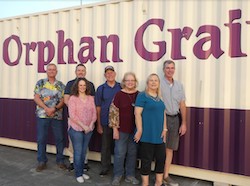 OGT Board members in front of new storage container