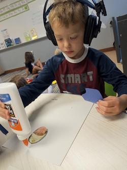 child listening with headphones