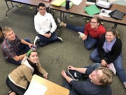 students sitting in a circle on the floor