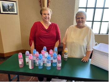 Two ladies with baby bottle project