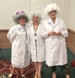 3 women dressed as scientists