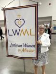 President Larson with LWML banner